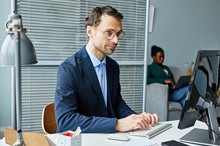  Employee navigating endpoint security management. 